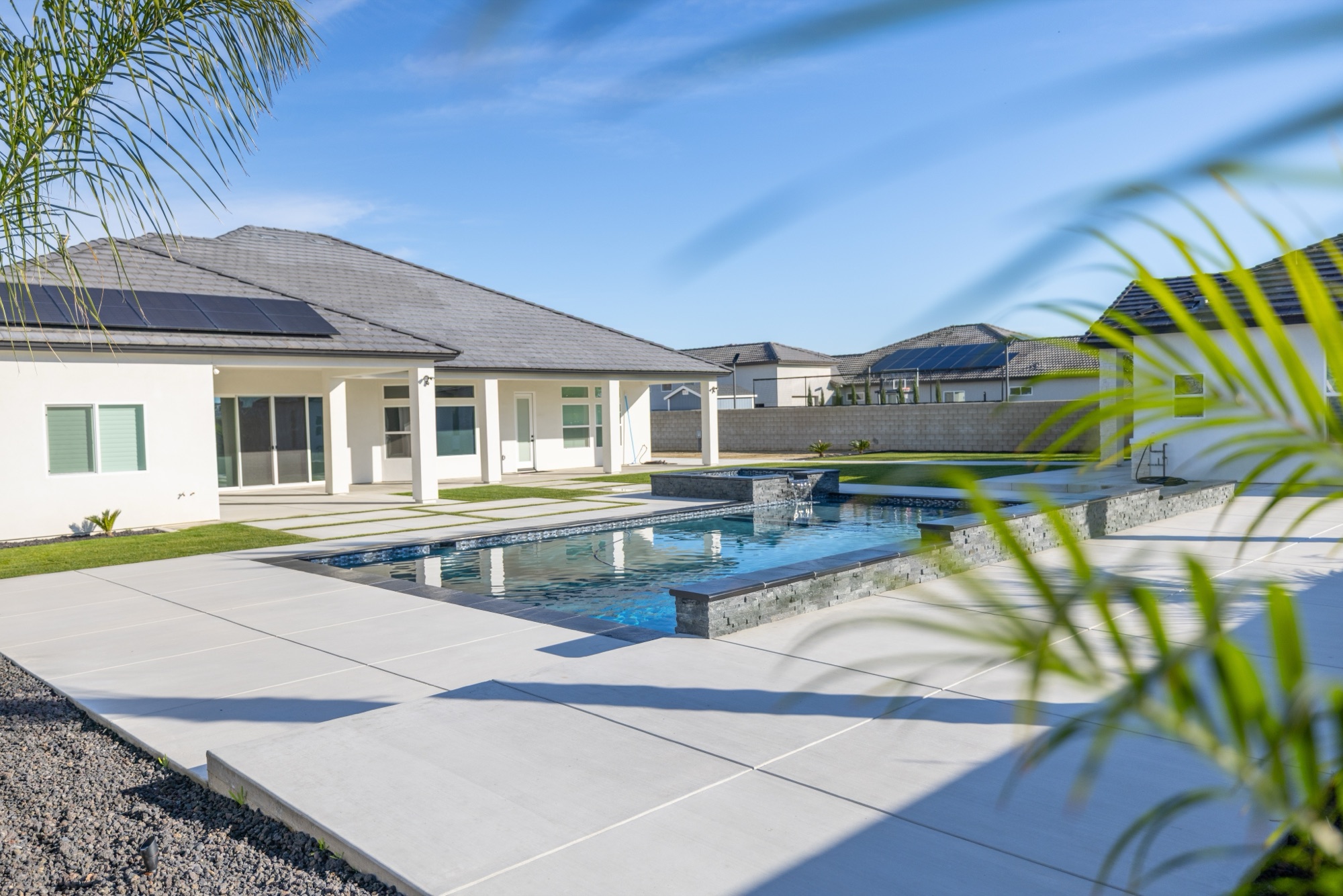 Custom gunite pool design — modern home with spa
