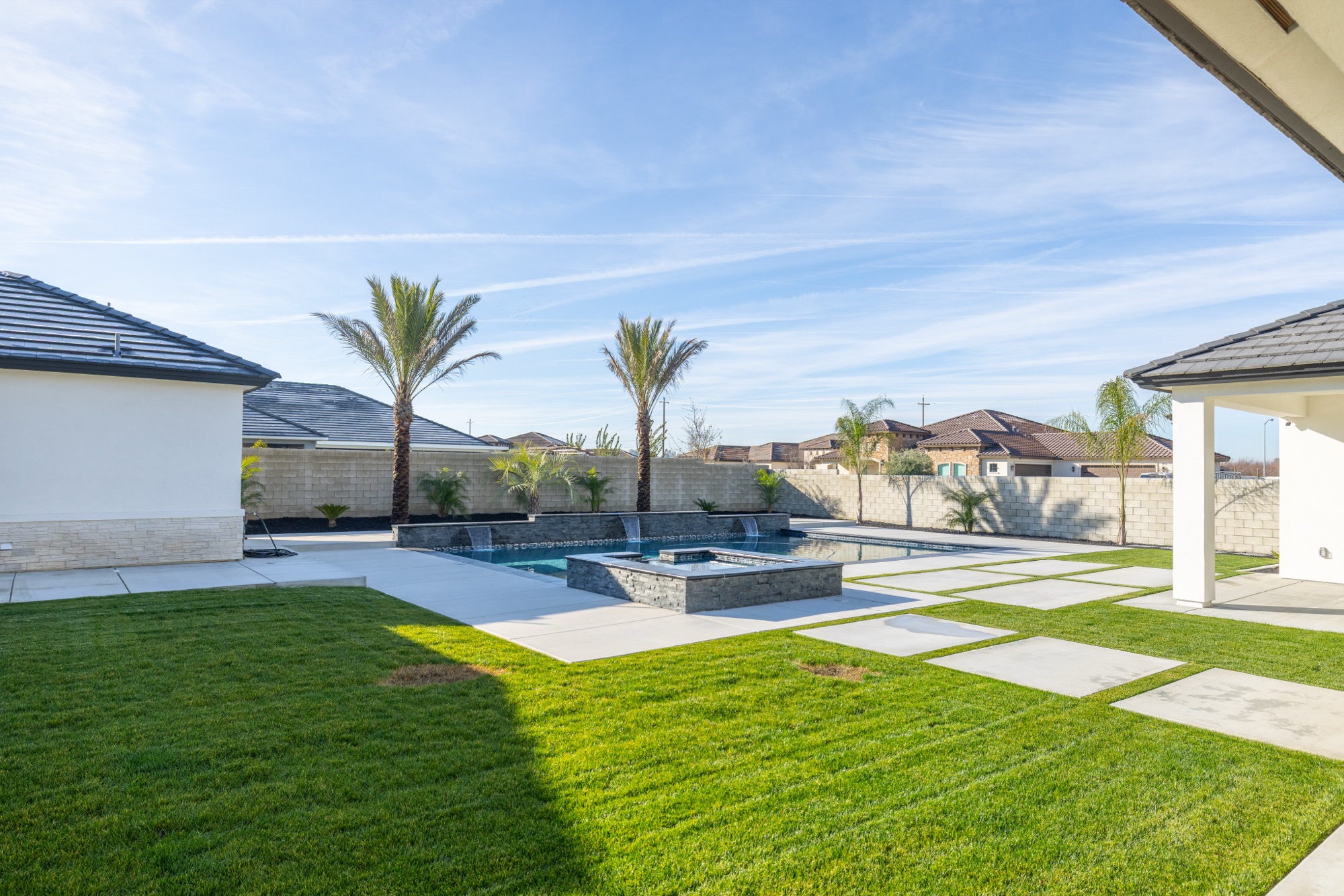 Pool with spa, fire pit, and outdoor living space